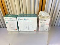 All three boxed items: Kasa Light Switch Dimmer, Kasa 3-Way Dimmer Kit, Enerlites Timer