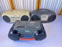 Front view of all three Sony boomboxes showing models and colors
