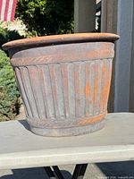 Side view showing fluted design and patina