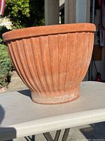 side view showing ribbed terracotta planter