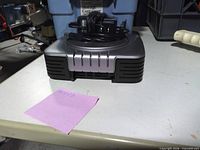 Front view of external hard drive with power adapter on top