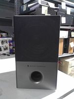 Front view of Altec Lansing subwoofer showing grille and port