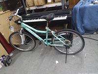 Full side view of teal Kent Avalon bicycle