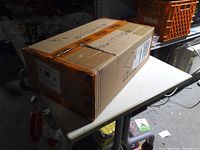 Sealed cardboard box of keyboards