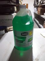 Front view of sealed Super Tech Bug Remover washer fluid jug
