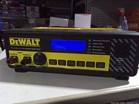 Front panel showing DeWalt branding, LCD, controls and terminals