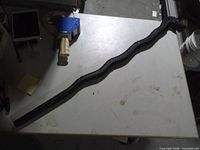 Full view of serpentine dragon cane on tabletop