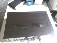 Top view of additional electronic device with vented cover and connectors (context view)