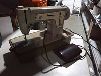 Overall view of Singer Fashion Mate sewing machine with foot pedal attached