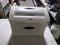 Front angled view showing complete shredder and branding