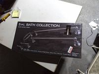Front of sealed box showing 5-piece contents and satin nickel finish