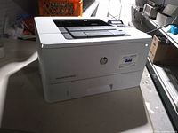Front left view of HP LaserJet Pro M402n printer showing exterior