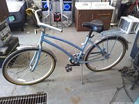 Full view of light blue Huffy Belford cruiser bicycle