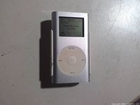 Front view of silver Apple iPod mini showing screen and click wheel