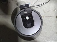 Top view of Roomba with charging dock visible