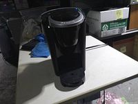 Front view of Keurig coffee maker showing drip tray and body