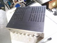 Top and side view showing vented black metal cover