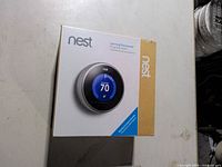 Sealed Nest Learning Thermostat retail box front showing product image and branding