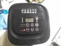 Top control panel powered on showing display and buttons