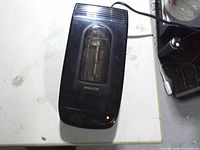 Top view of Philco VHS rewinder showing brand logo, lid window and indicator light