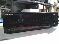 Front view showing Pioneer branding, display, buttons, volume knob and headphone jack