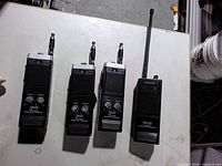 Front view of four handheld CB radios