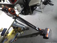 Full view of Shark Rocket stick vacuum standing on floor with power cord