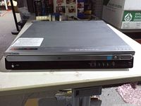 Front and top view of Samsung 5-disc DVD changer showing control panel and overall condition