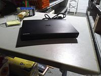 Front angled view of Samsung Blu-ray player on table