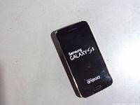 Front of Samsung Galaxy S5 powered on to splash screen