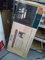 Factory-sealed box showing Sauder Computer Desk With Hutch branding