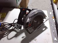 Left side view showing Skilsaw branding on blade guard and overall tool