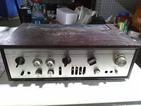 Full front view of Lux Corp integrated amplifier in wood case