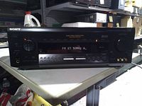 Front view showing display, controls and brand