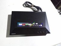 Front and top view of Sony Blu-ray player with streaming service sticker and attached power cord