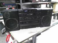 Front view showing main unit with speakers, controls and drivers