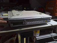 Front view showing control panel, display and CD lid
