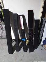 Group of five soundbars standing upright