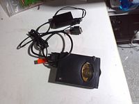 Top view of SyQuest SparQ drive with adapter and cable