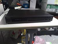 Front view showing Technics branding, digital display and control layout