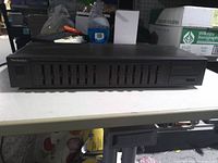 Front view showing Technics branding, 12 sliders, control layout