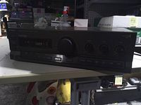 Front view of Technics SU-G91 amplifier showing controls and display
