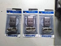 Front view of three sealed Philips USB 2.0 auto sharing switch packages