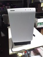 Front view of Veva air purifier showing white panel and indicator lights