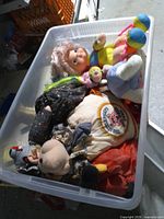 Open tote showing top layer of plush toys
