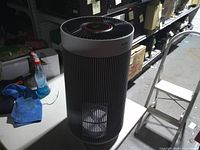Full view of cylindrical Winix air purifier on table