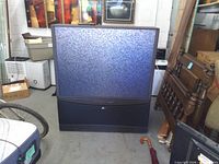 Front view of Zenith Inteq rear-projection TV showing screen and cabinet