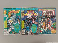 Front covers of three bagged comics showing titles and condition