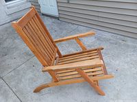 Front angled view of wooden patio chair