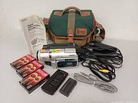 Full lot: camcorder, bag, manual, tapes, remote, battery, cables, charger